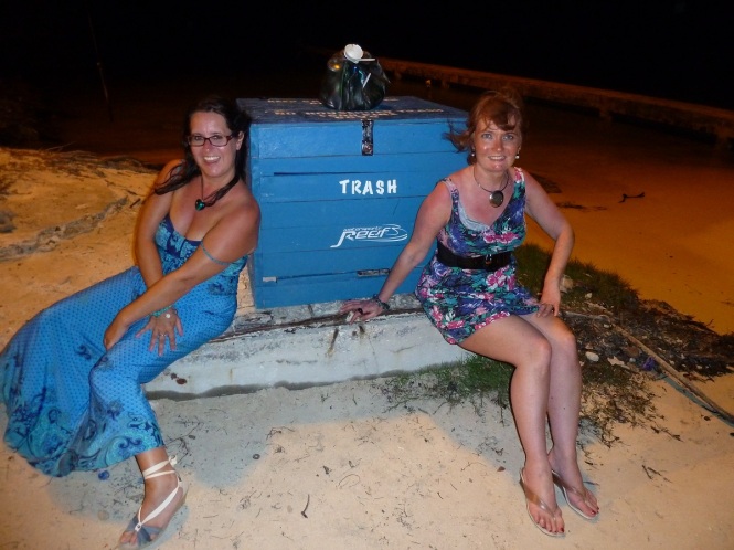 hey girls sit on this lovely bench ..you'll look really cool with the beach behind you